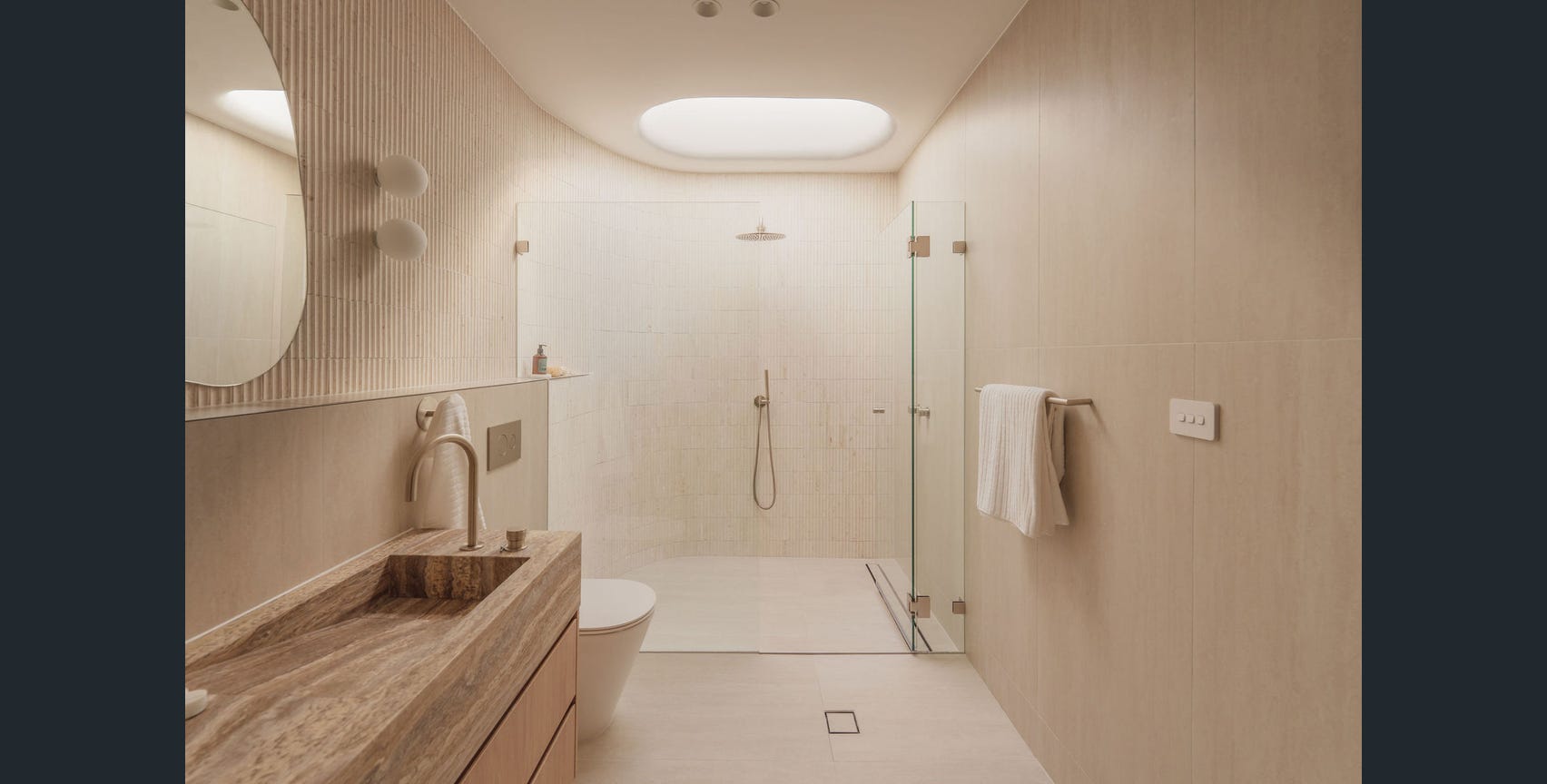 Stone vanity and walk-in shower at Deborah, Eastwood