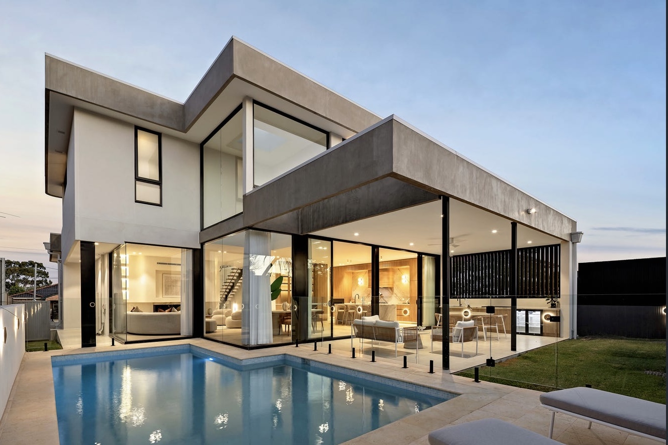 Rear elevation and swimming pool at dusk at Arthur, Ryde