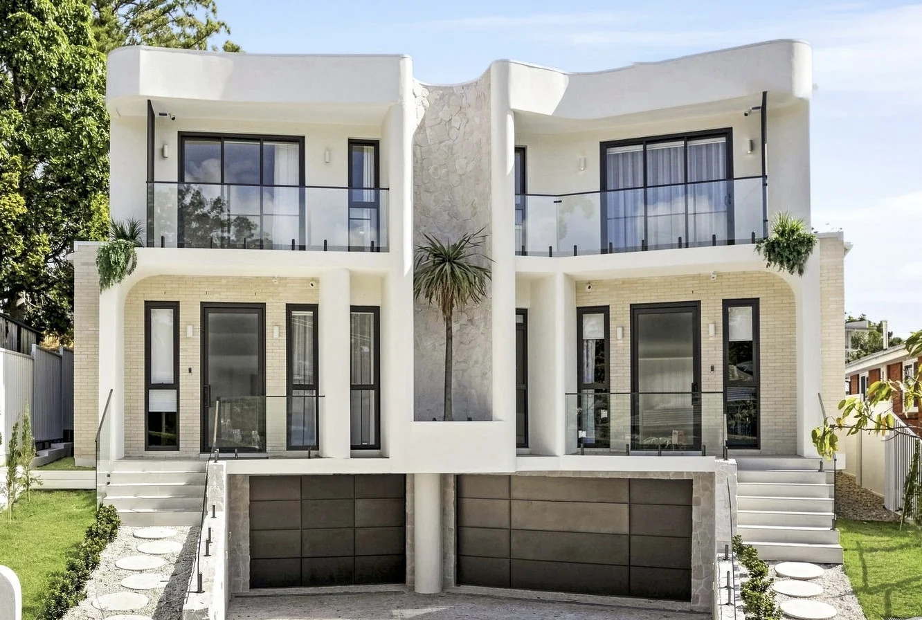 Front elevation with curved white balconies at Deborah, Eastwood